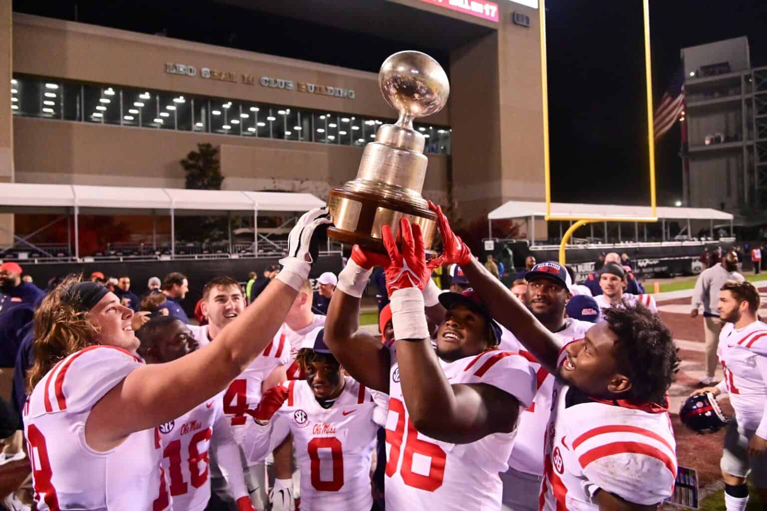 The 12 College Football Rivalry Trophies With The Best Backstories